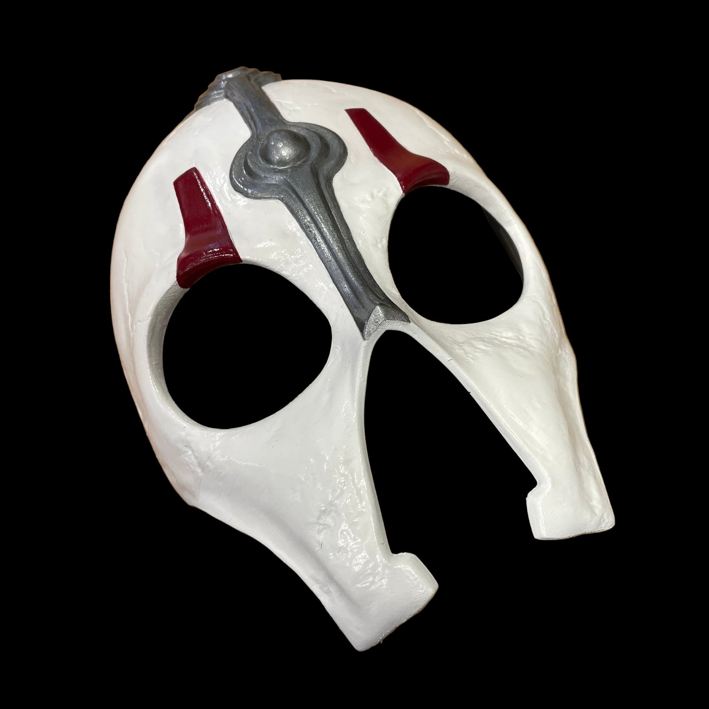 White Darth Nihilus mask with red and gray accents on a surface