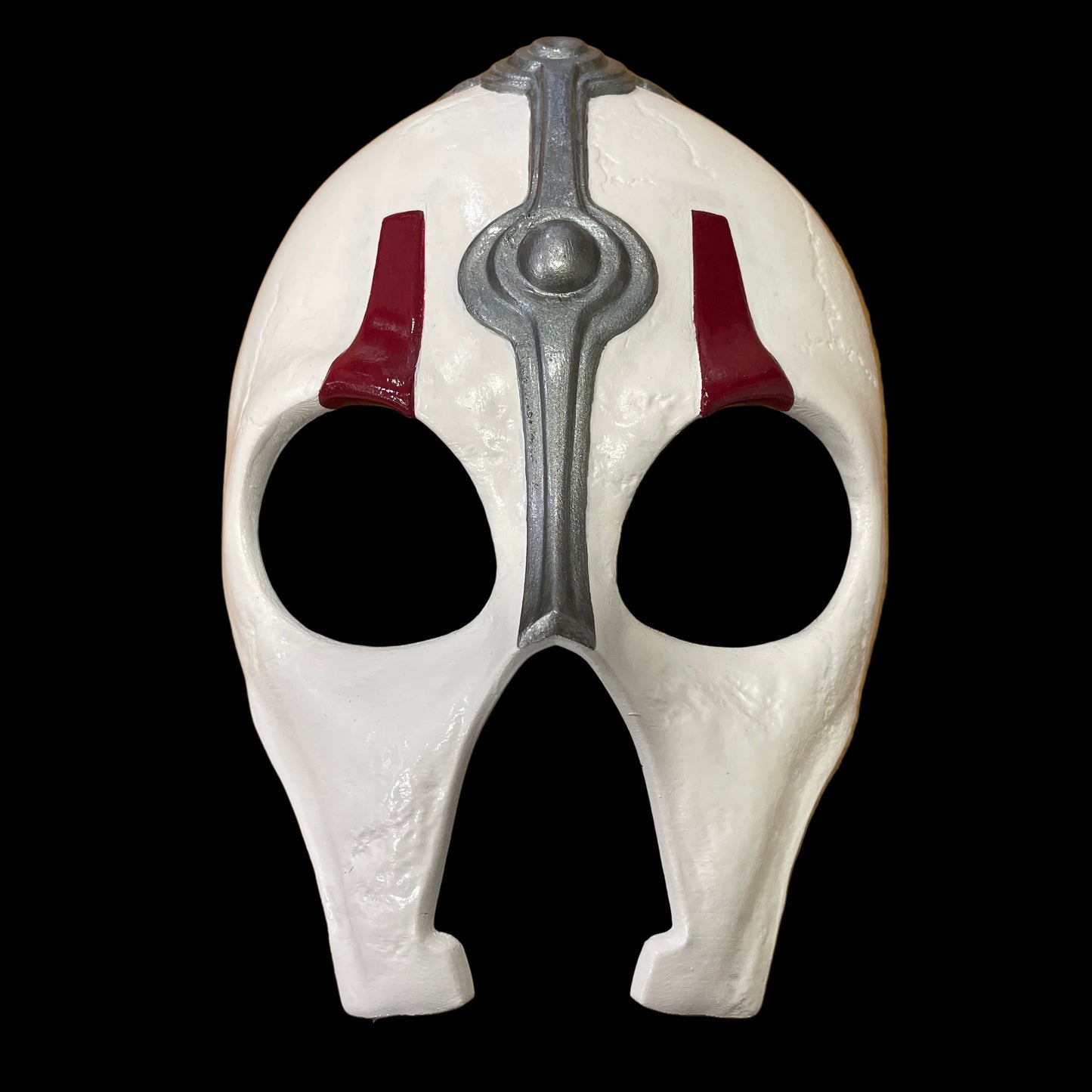 White Darth Nihilus mask with red and gray accents on a surface