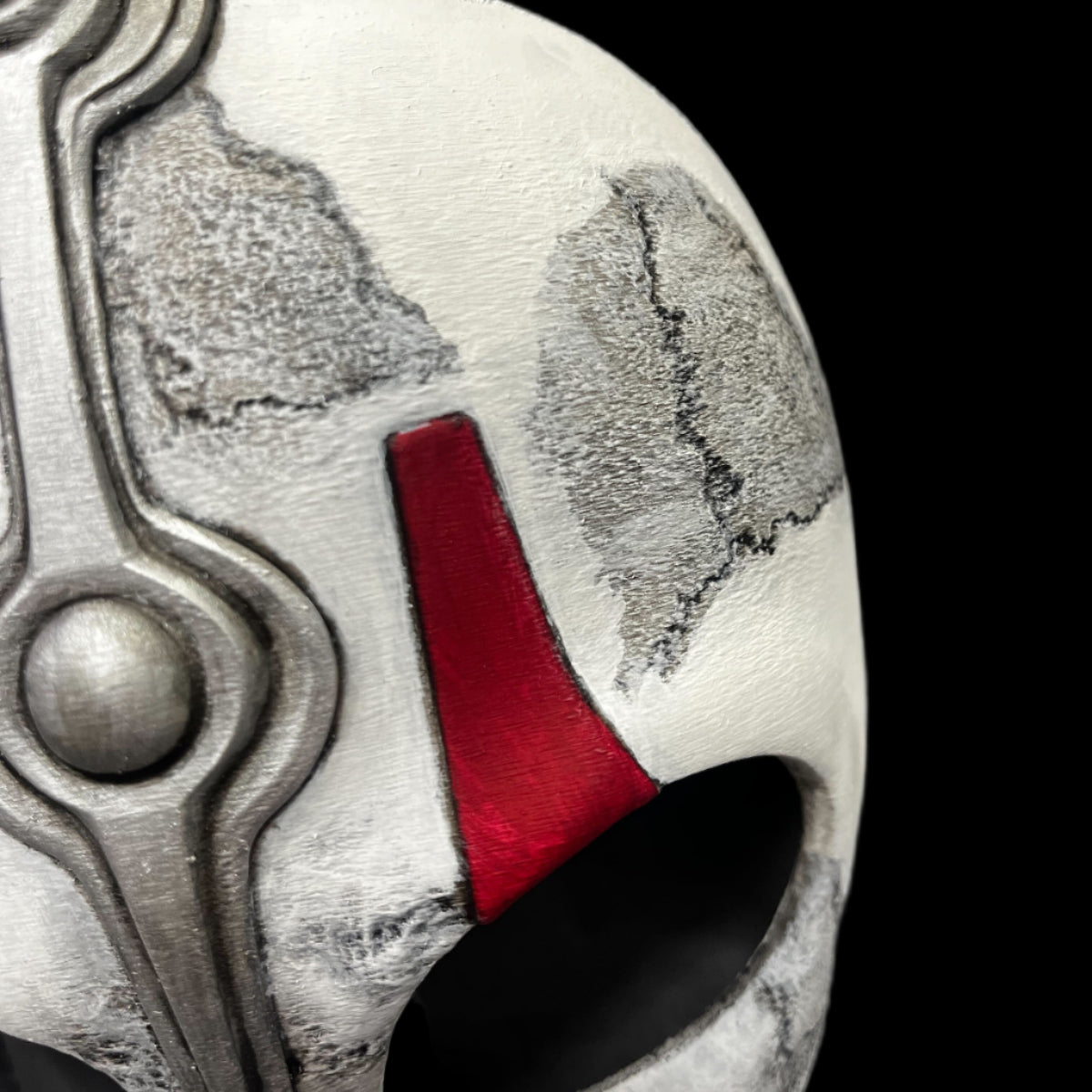 Close-up of a helmet with a red interior on a gray surface