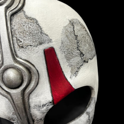 Close-up of a helmet with a red interior on a gray surface