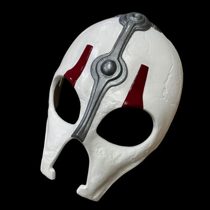 White Darth Nihilus mask with red and gray accents on a surface
